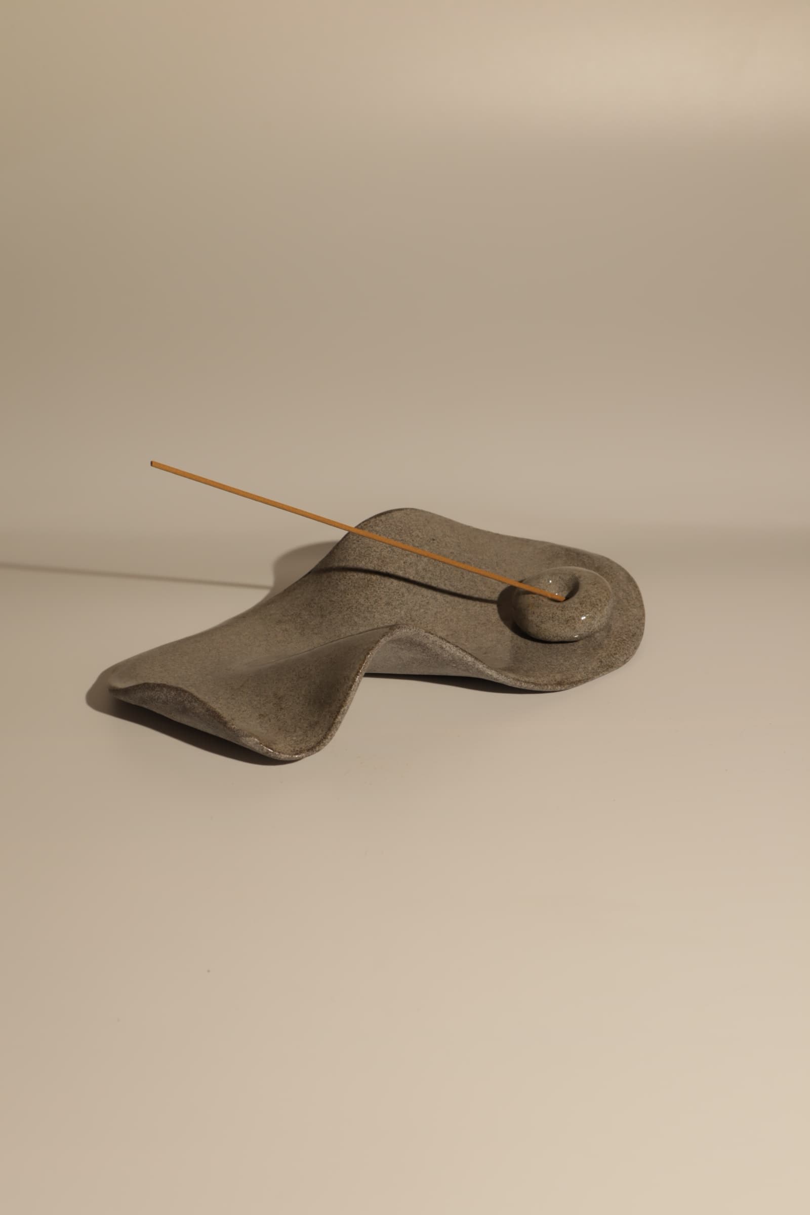 Sculptural grey ceramic incense rest from the Granite collection