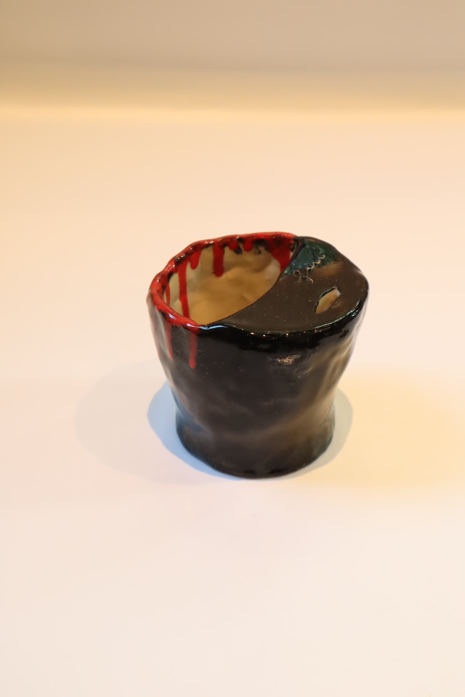 dog jaw trinket + black red drip cup, made by Julie Quadrio
